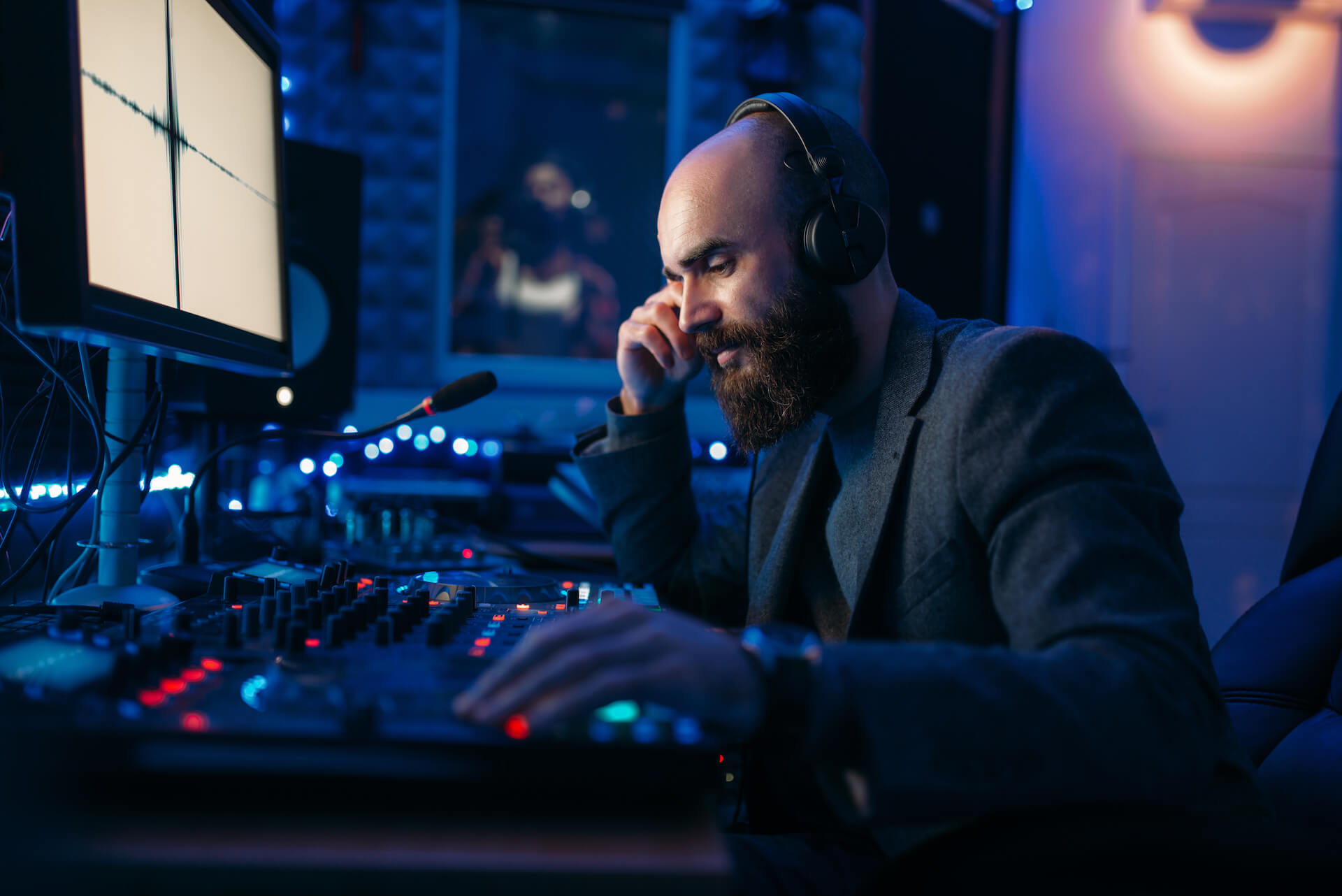 sound-engineer-in-headphones-listens-composition-2021-08-26-16-26-33-utc.jpg